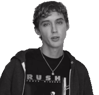 a man wearing a black shirt that says rush
