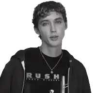 a man wearing a black shirt that says rush