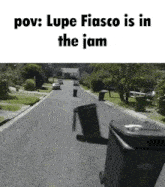 a picture of a garbage can on the side of a road with the caption " pov lupe fiasco is in the jam "