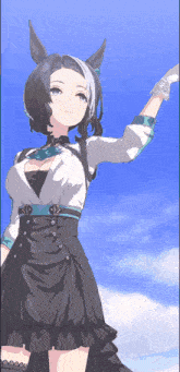 a girl in a black and white dress is standing in front of a blue sky with her hand in the air