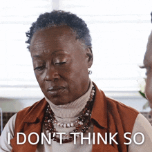 a woman with a turtleneck and a necklace says " i don 't think so "