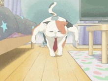 a calico cat wearing a red tie is walking in a living room