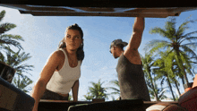 a man and a woman standing in the back of a car