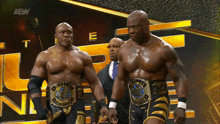 two wrestlers with aew written on the screen behind them