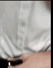 a close up of a white item with a blurred background .