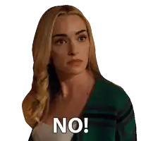a woman in a green sweater says no on her face