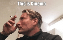 a man smoking a cigarette with the caption this is cinema