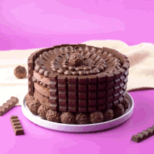 a chocolate cake made out of kitkat bars and ferrero rocher