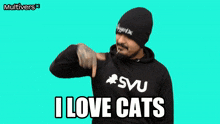 a man wearing a hoodie that says i love cats on it