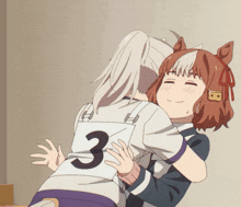 a girl hugging another girl with the number 3 on her back