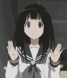 a girl in a school uniform with hearts on her shirt