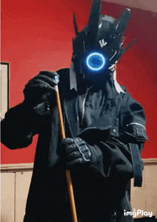 a man in a futuristic costume holds a pool cue