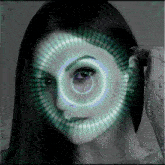 a woman 's face with a green circle around her eye