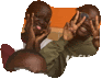 two children are making a peace sign with their hands over their eyes .