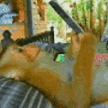a squirrel is laying on its back on a couch with a knife in its mouth .