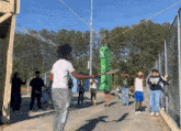 a group of people are playing tennis and one of them is wearing a shirt that says georgia