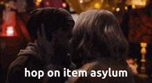 a man and woman are kissing with the words hop on item asylum above them