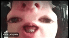 a close up of a person 's face with the name marus_oficjalne on the bottom
