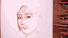 a drawing of a woman 's face with colored pencils next to it