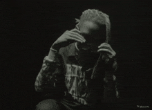 a black and white photo of a man wearing a shirt that says prin