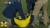 a football game is being played between the rutgers and the michigan huskies
