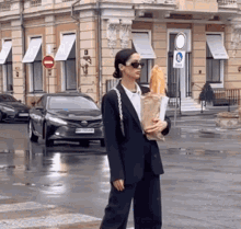 Girl With Baguette Drinking In The Street GIF - Girl With Baguette Drinking In The Street GIFs