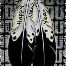 a feather with the words happy new year on it