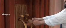 a man opens a door with a viggle.ai logo in the background
