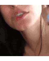 a close up of a woman 's face with headphones