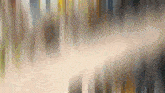 a blurred image of a waterfall with a few trees visible
