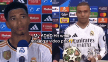 two soccer players are standing next to each other with emirates fly better written on their shirts