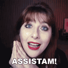a close up of a woman 's face with the words assistam written below her
