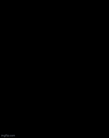 a robot is flexing its muscles while wearing a yellow jacket and a hat .