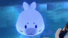 a blue rabbit with a face on it is floating in the water