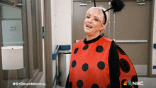 a ladybug costume with nbc written on the bottom right