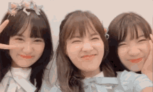 three girls are posing for a picture with one wearing a flower crown