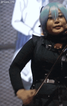 a woman with blue hair is playing a violin with the number 070 on the bottom right