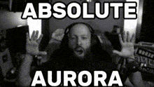 a black and white photo of a man with headphones and the words absolute aurora