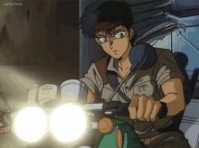 a man is riding a motorcycle with a shell c.t. shirt on