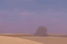 a statue of a man 's head with wings is flying through the air .