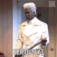 a man in a white coat is holding a sword and says " seriously "