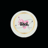 a white circle with a pink heart and the word rei on it