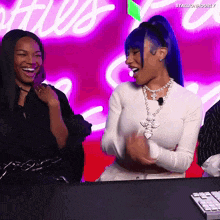 a woman with blue hair is laughing in front of a sign that says stallion hourly