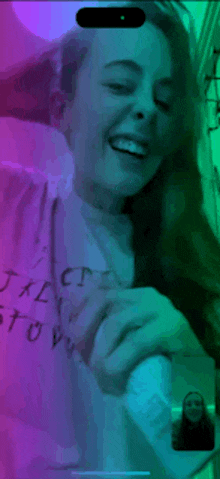 a woman wearing a t-shirt that says ' tact ' on it
