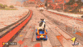 a cow is driving a toy car on a track with 18 x 3 / 3