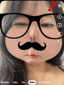 a woman wearing glasses and a mustache has a question mark on her head