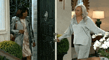 two women are standing in front of a door talking
