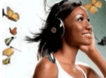 a woman wearing headphones is listening to music