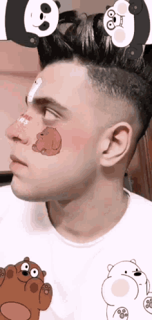 a man wearing a we bare bears t-shirt has bears on his face
