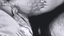 a black and white photo of a woman covering her mouth with her hand and the words baby is i could ve